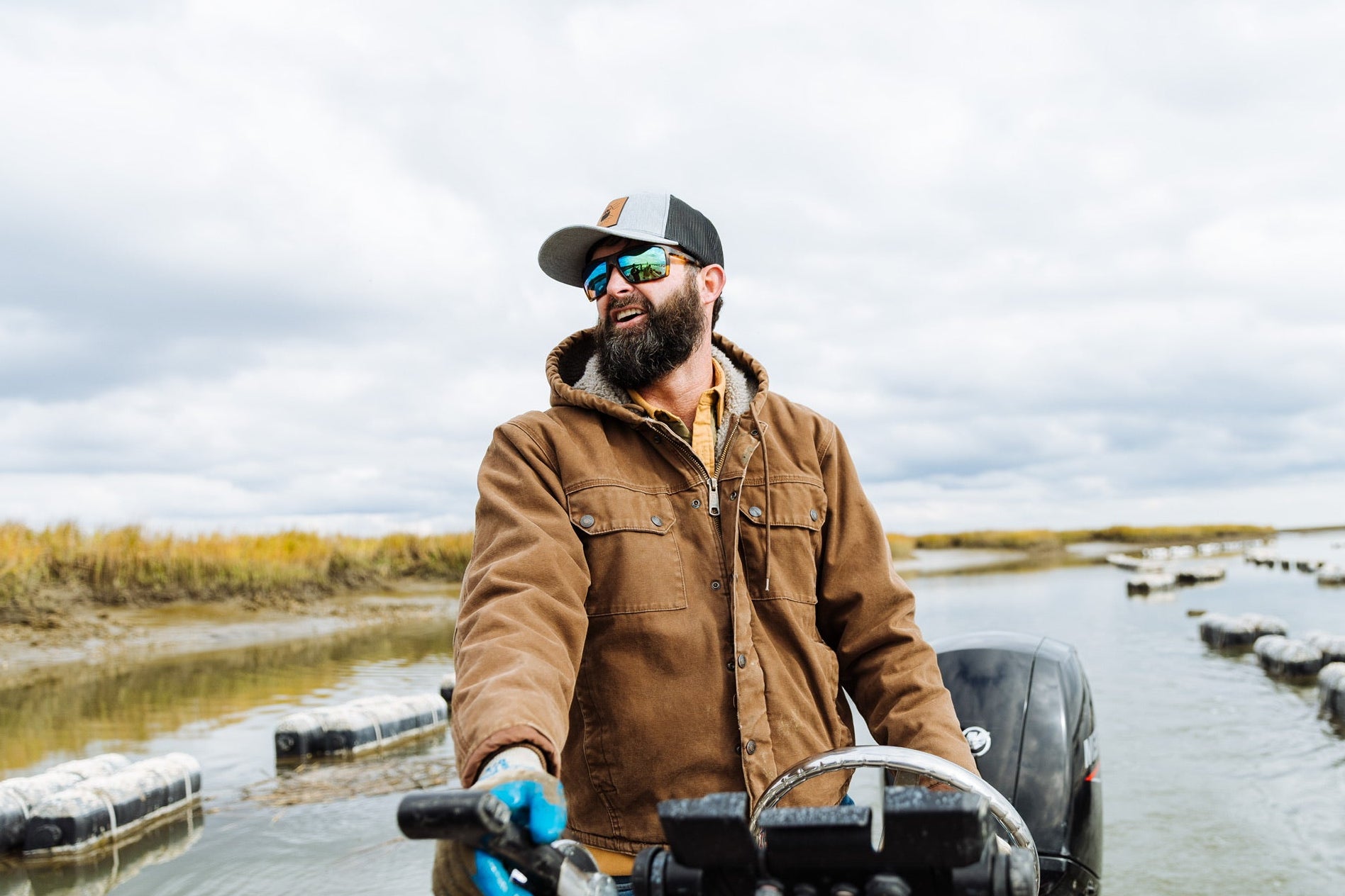 Man wearing polarized fishing glasses driving through the marsh of south carolina.