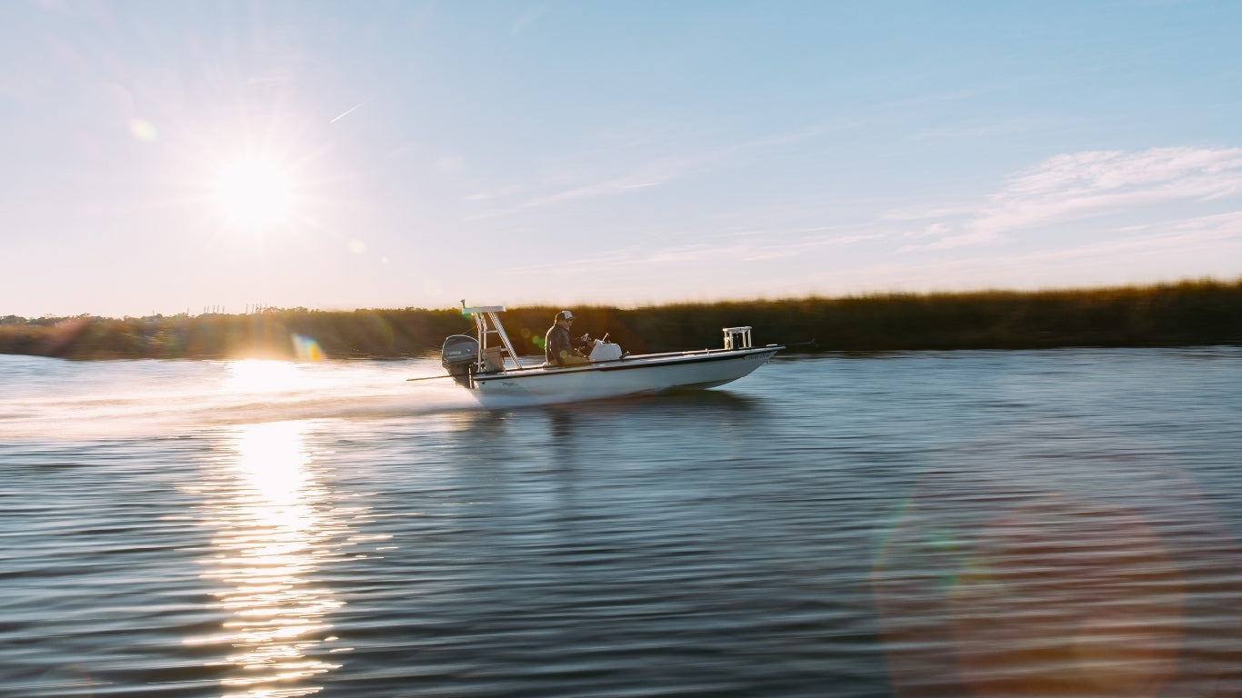 two men in a technical poling skiff in Charleston 